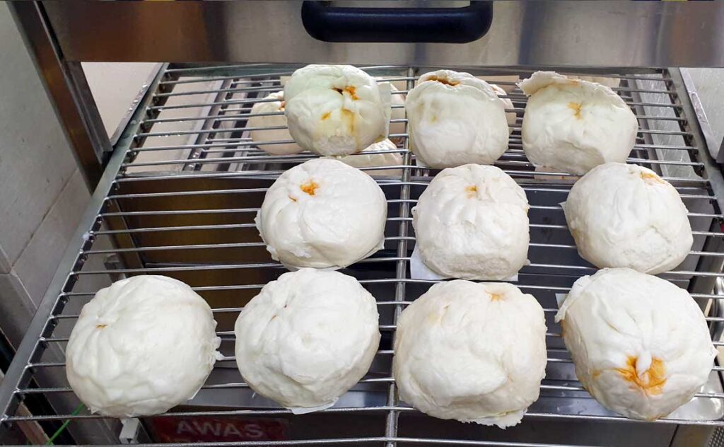 Fluffy Pau's on YikMun's Steamer Trays. Taken Out only When You Order.